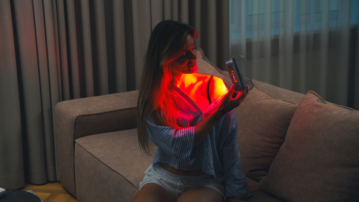 EMR-TEK Firefly portable red light therapy device in use